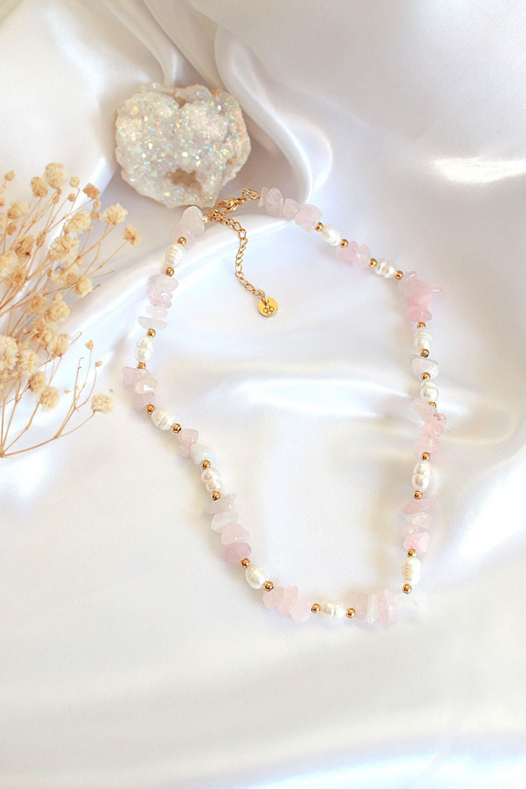 a necklace on a white cloth