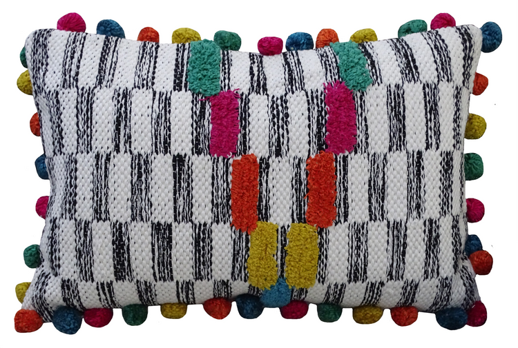 a black and white striped pillow with colorful pom poms