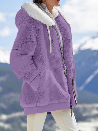 a woman in a purple coat