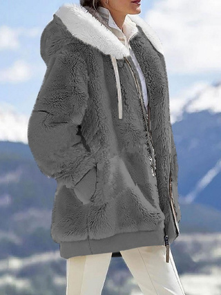 a woman wearing a fur coat
