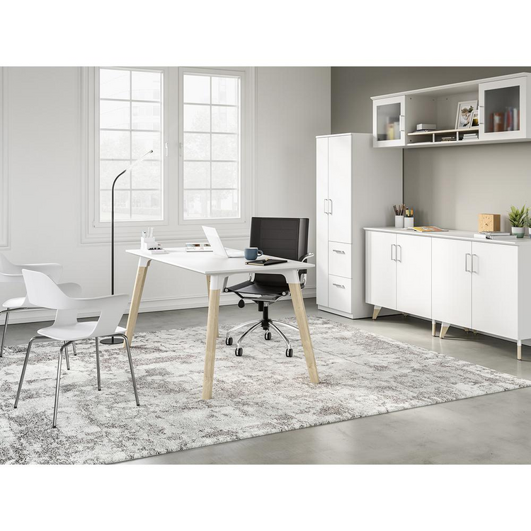 a white office with a desk and chairs