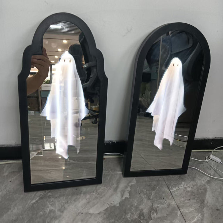 two mirrors with a ghost on them