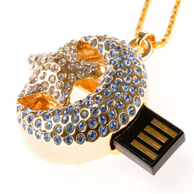 a gold necklace with a star and a flash drive