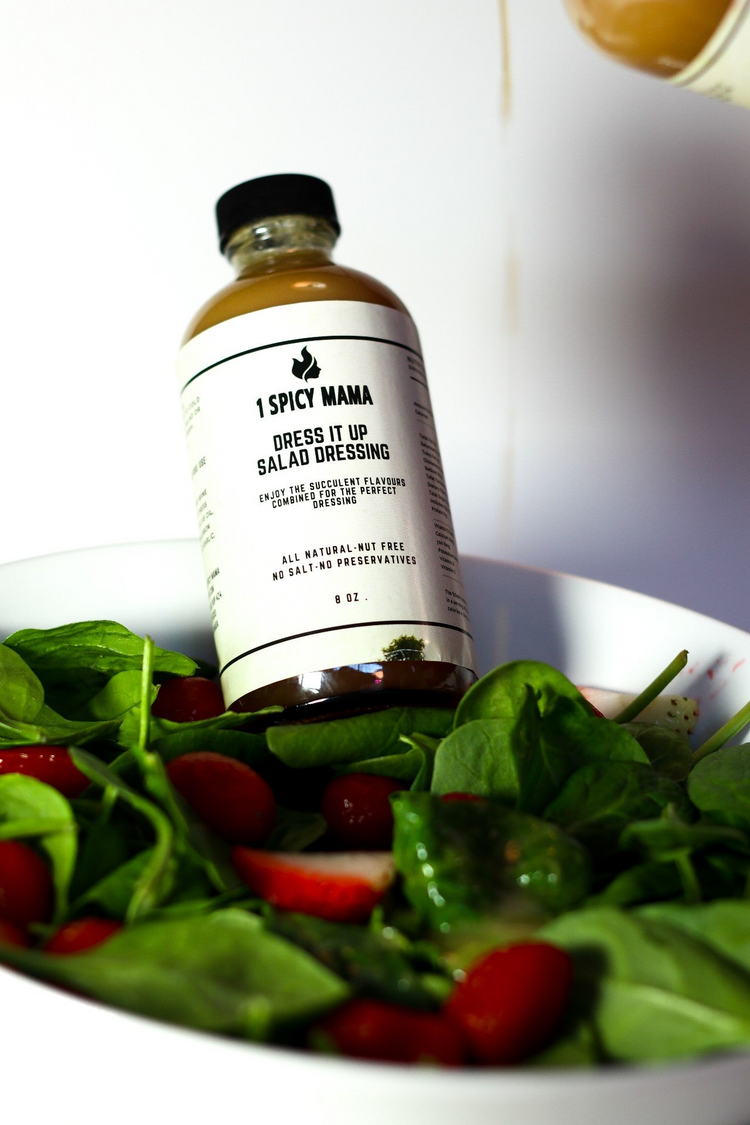 a bottle of salad dressing on a plate