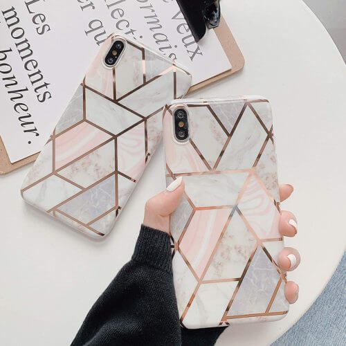a hand holding a phone case