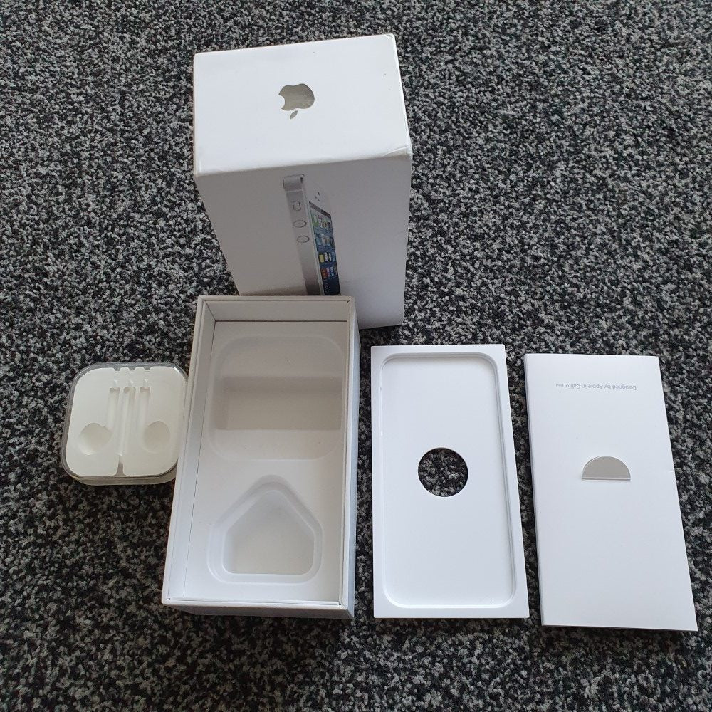 a white box and a box on a grey surface