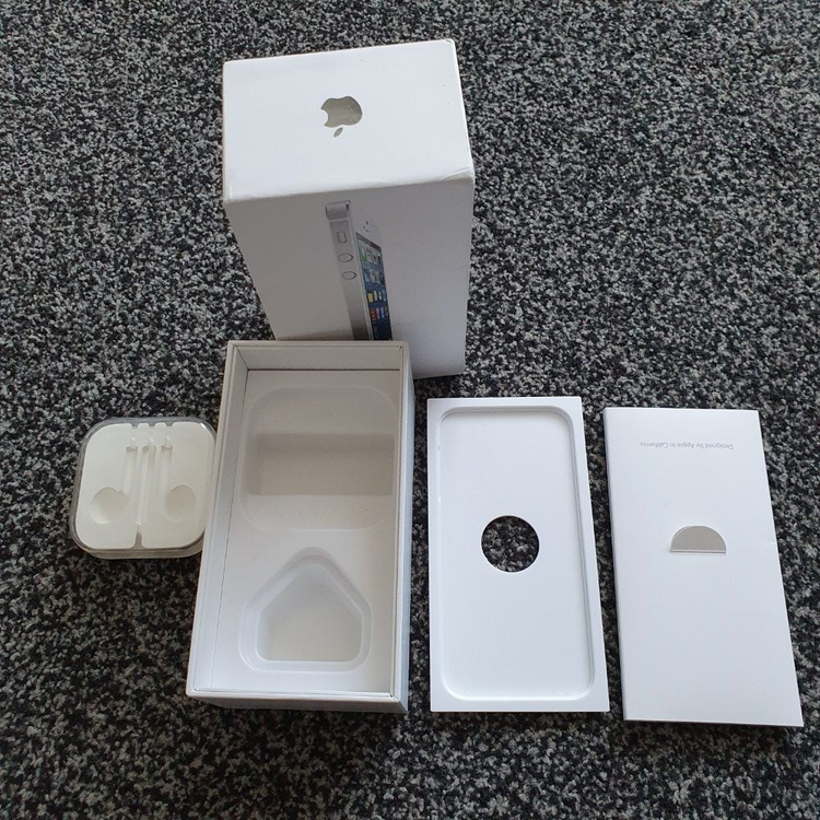 a white box and a box on a grey surface