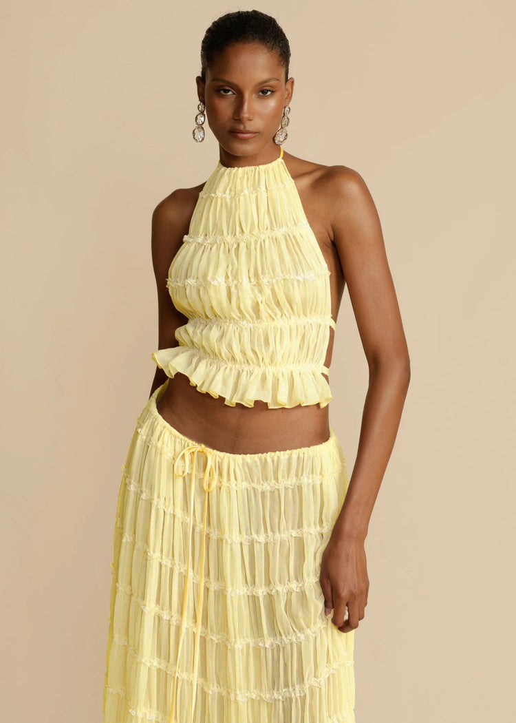 a woman in a yellow dress