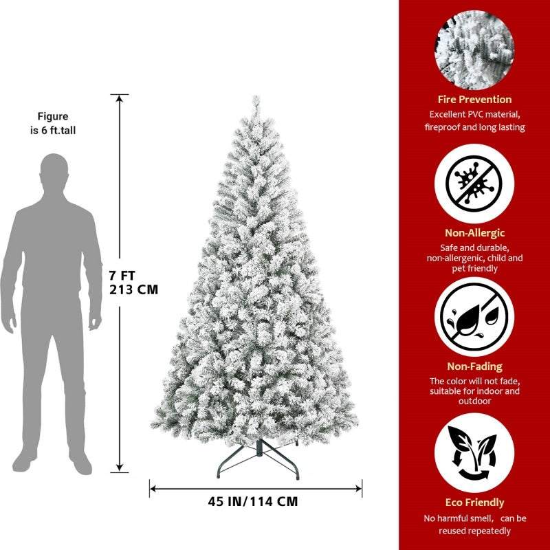 a man standing next to a christmas tree