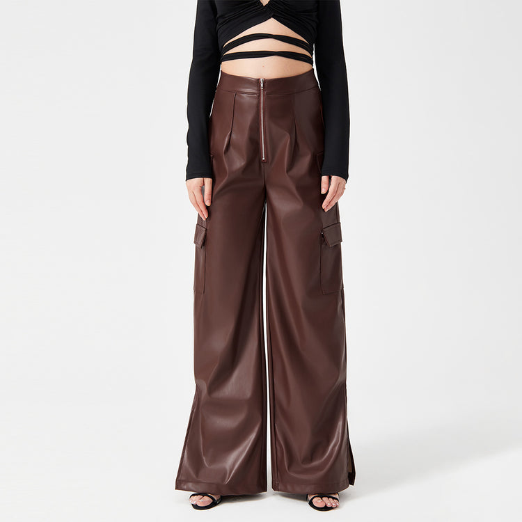 a woman wearing a black top and brown pants