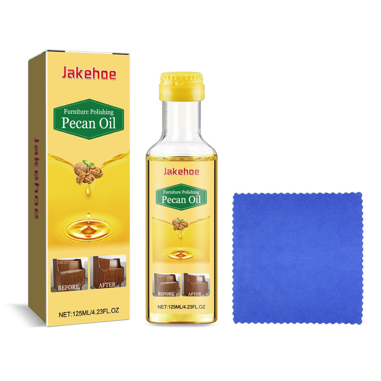 a bottle of oil next to a box and a cloth