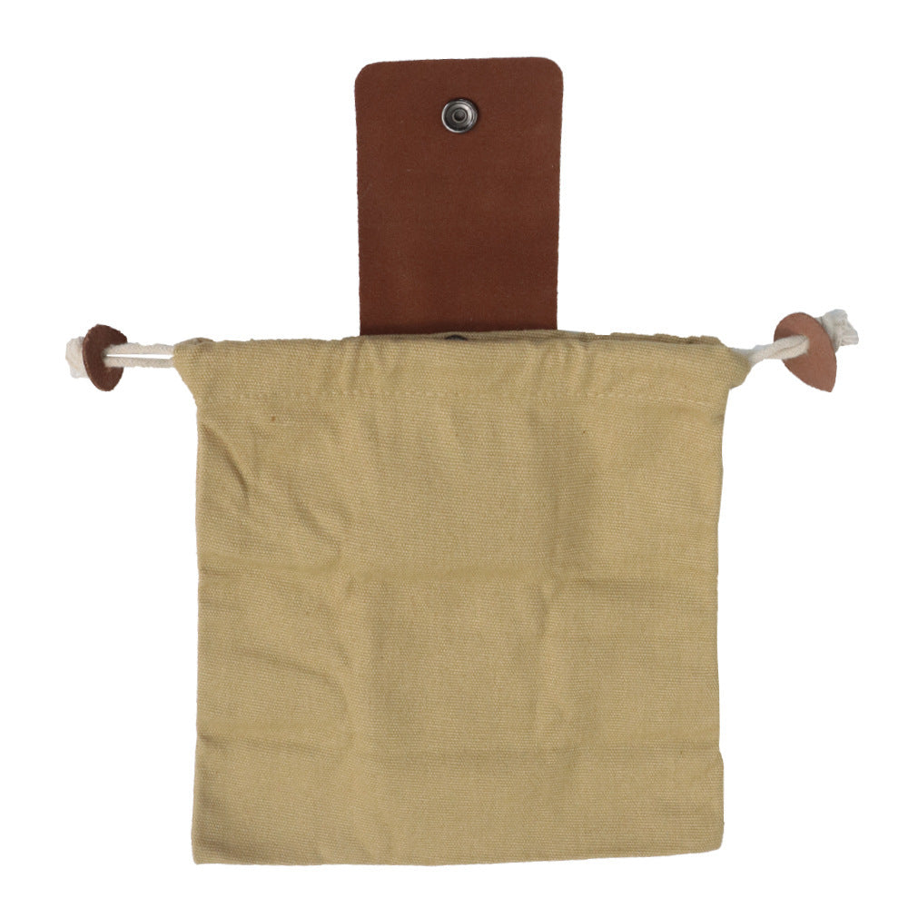 a brown cloth bag on a metal rod
