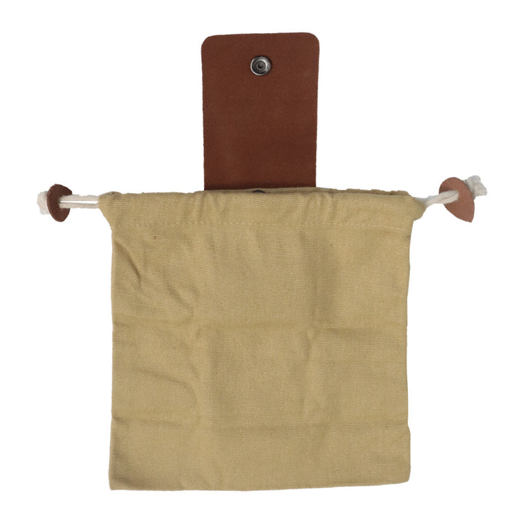 a brown cloth bag on a metal rod