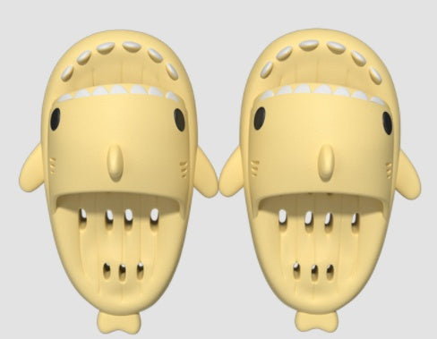 a pair of yellow plastic shark shaped objects