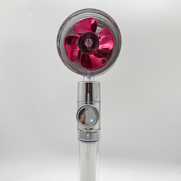 a small fan with a red propeller