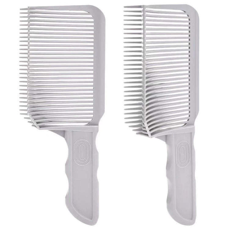 a pair of white combs
