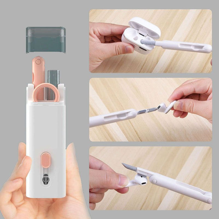a hand holding a white device