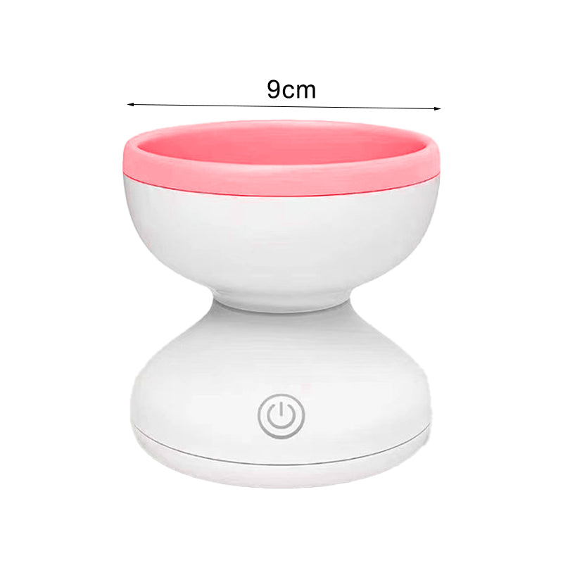 a white and pink bowl with a button