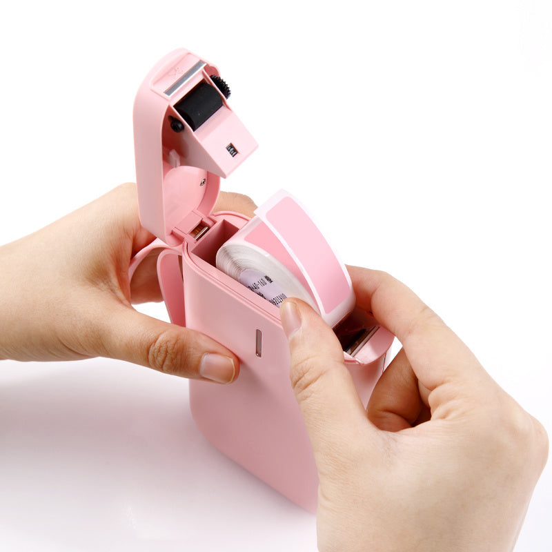 a pink tape dispenser with a tape dispenser