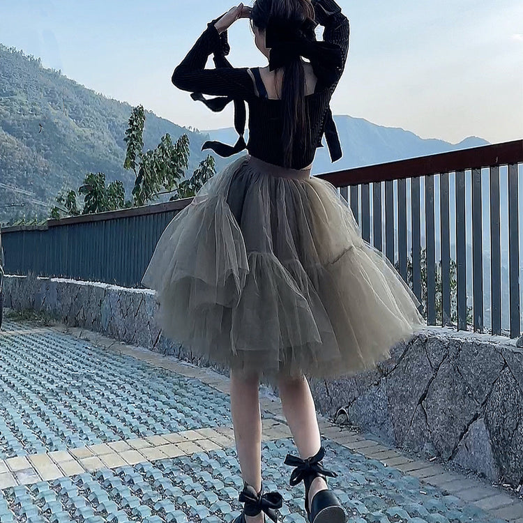 a woman in a tutu and high heels