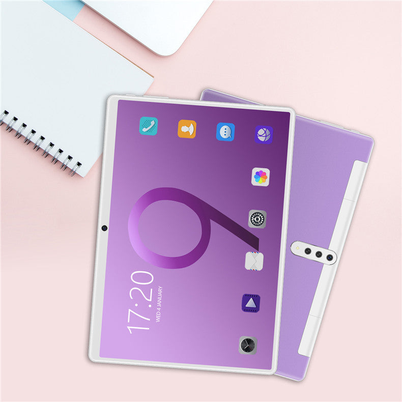 a tablet and notebook on a table