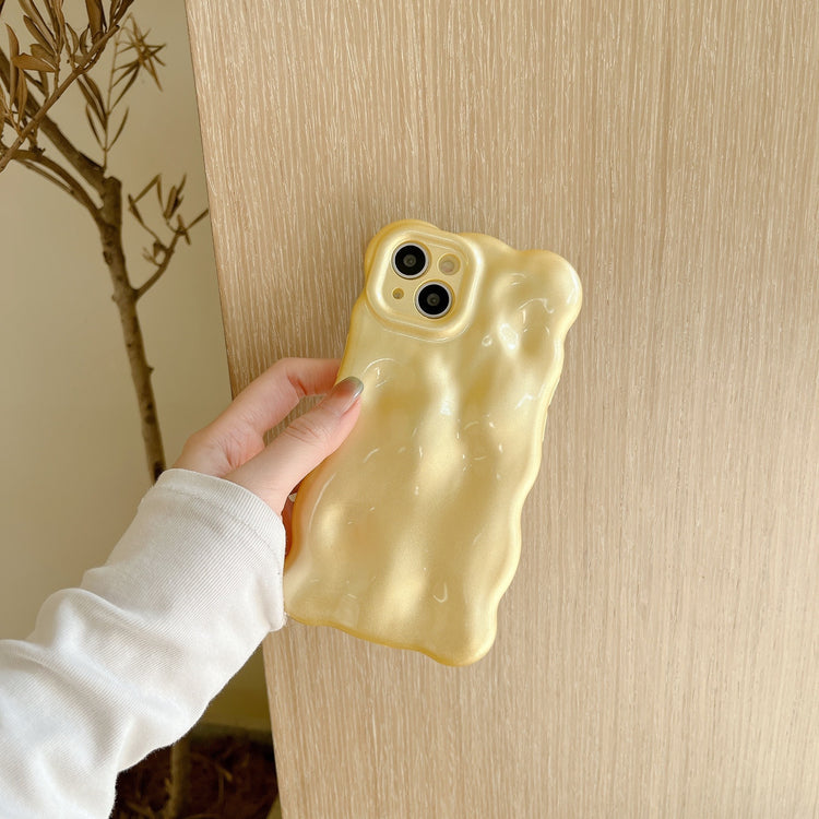 a hand holding a phone case