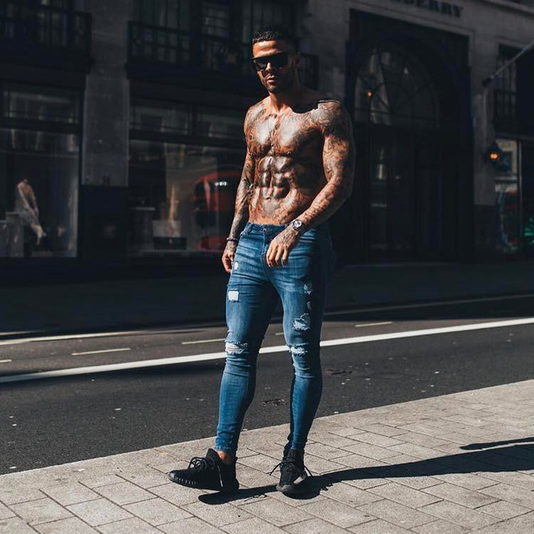 a man standing on the sidewalk