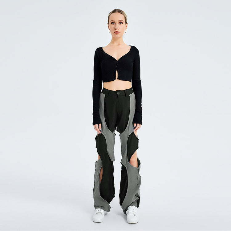 a woman in a black top and grey pants