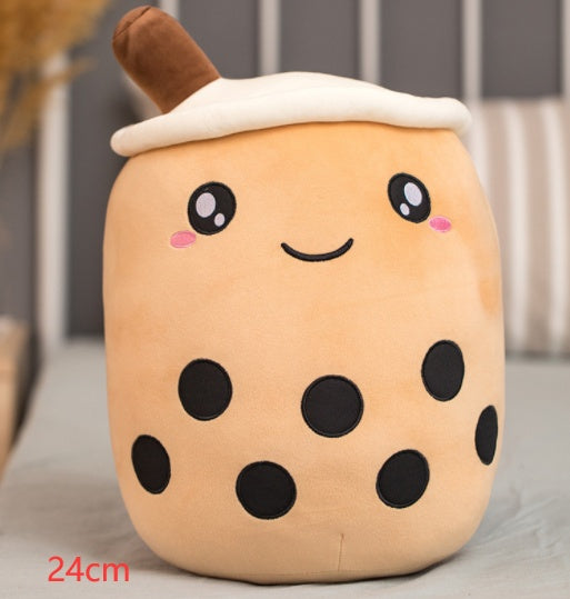 a stuffed animal with a face and black dots