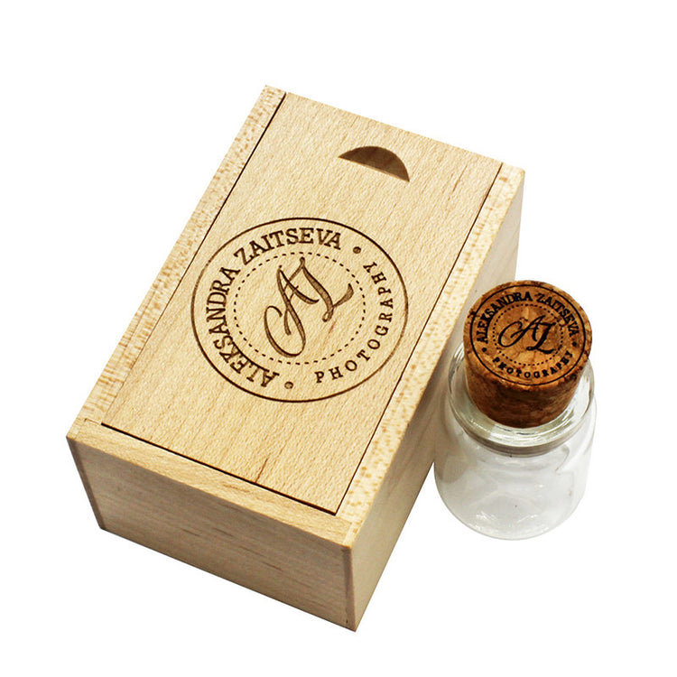 a wooden box with a cork on top and a small bottle