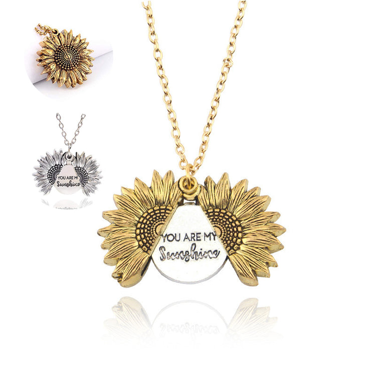 a necklace with sunflowers and words