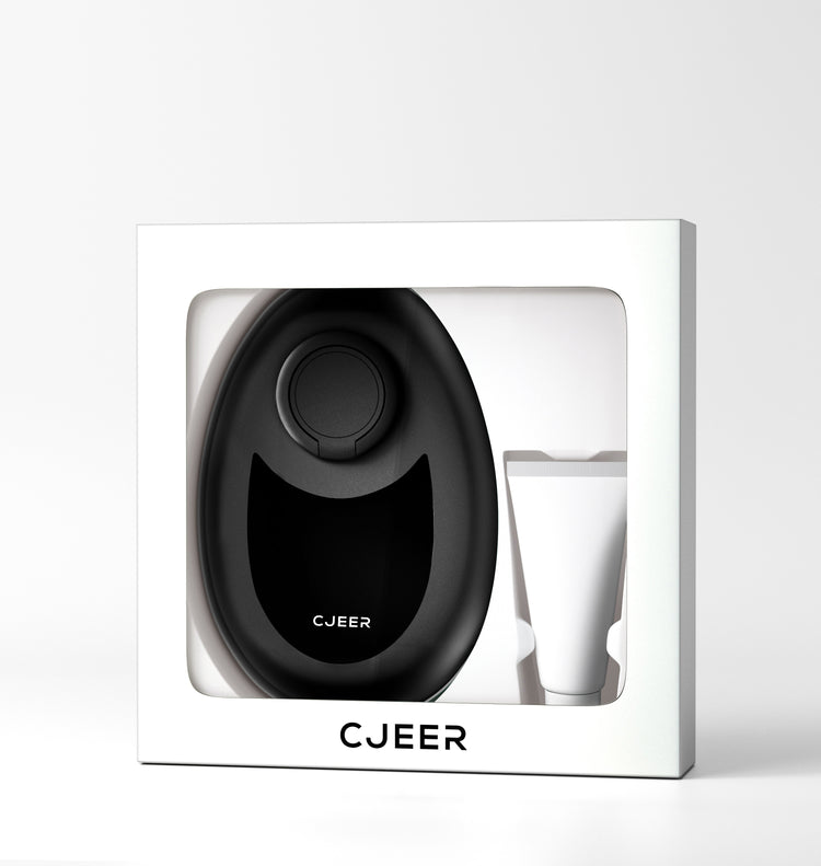 a black oval object in a white box