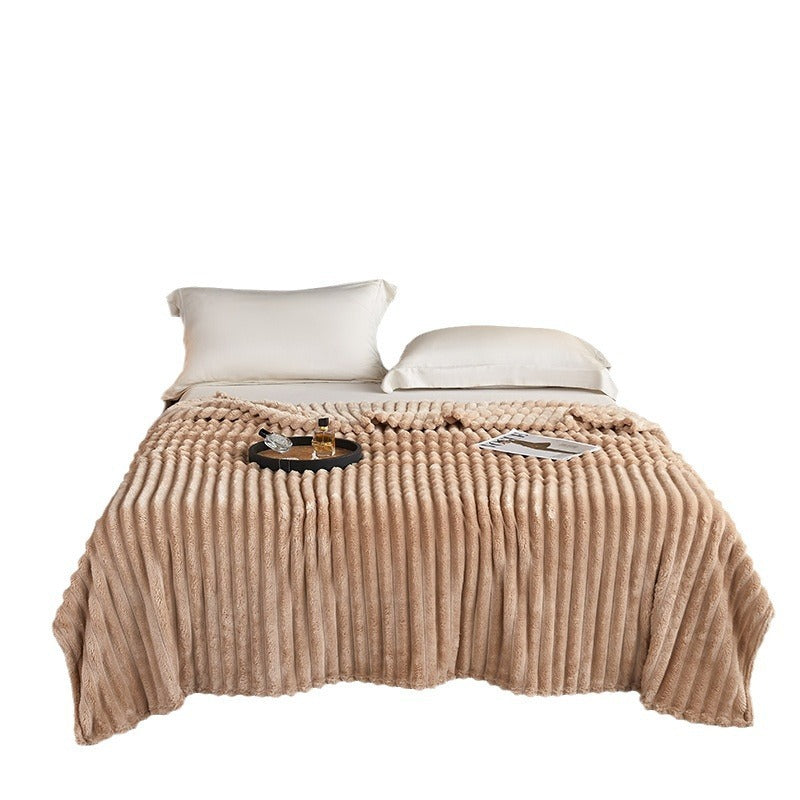 a bed with a tray of food and a tray of perfume on it