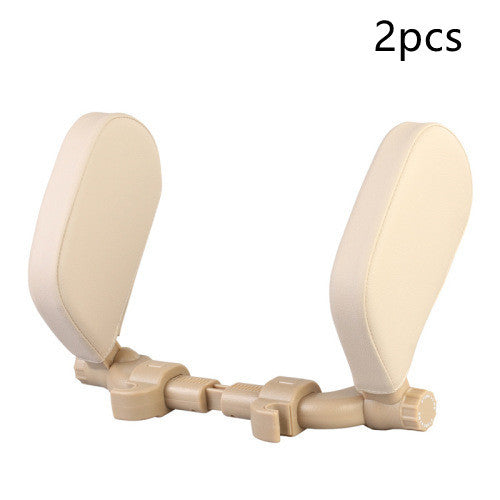 a pair of white plastic headrests