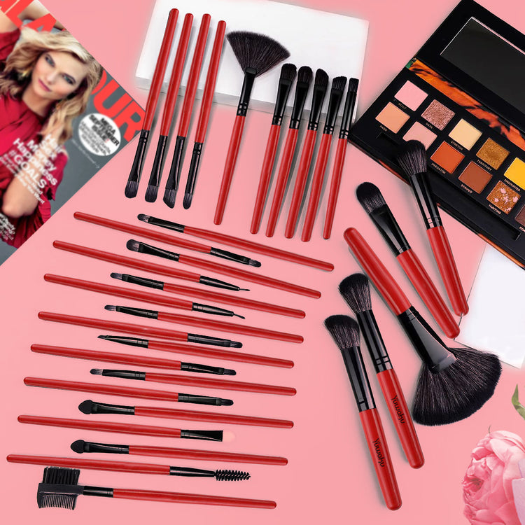 a group of makeup brushes and a magazine