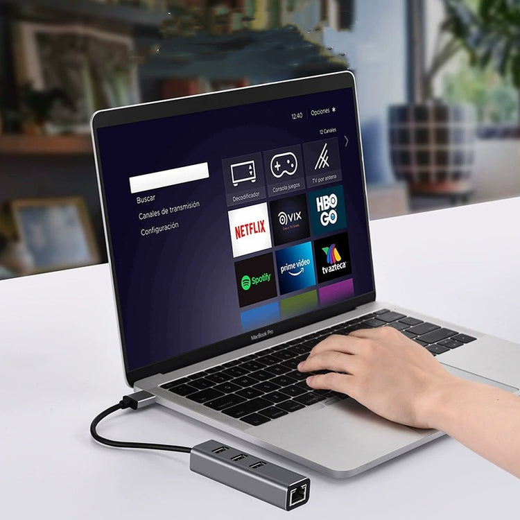 a hand on a laptop