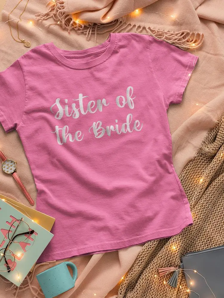 a pink shirt on a blanket