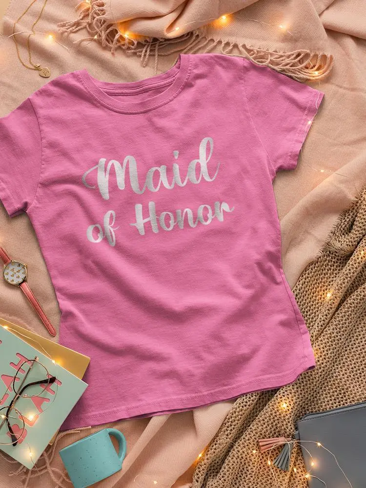 a pink shirt on a blanket