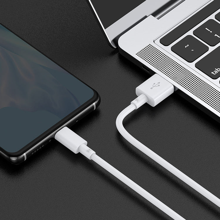 a cellphone charging from a laptop