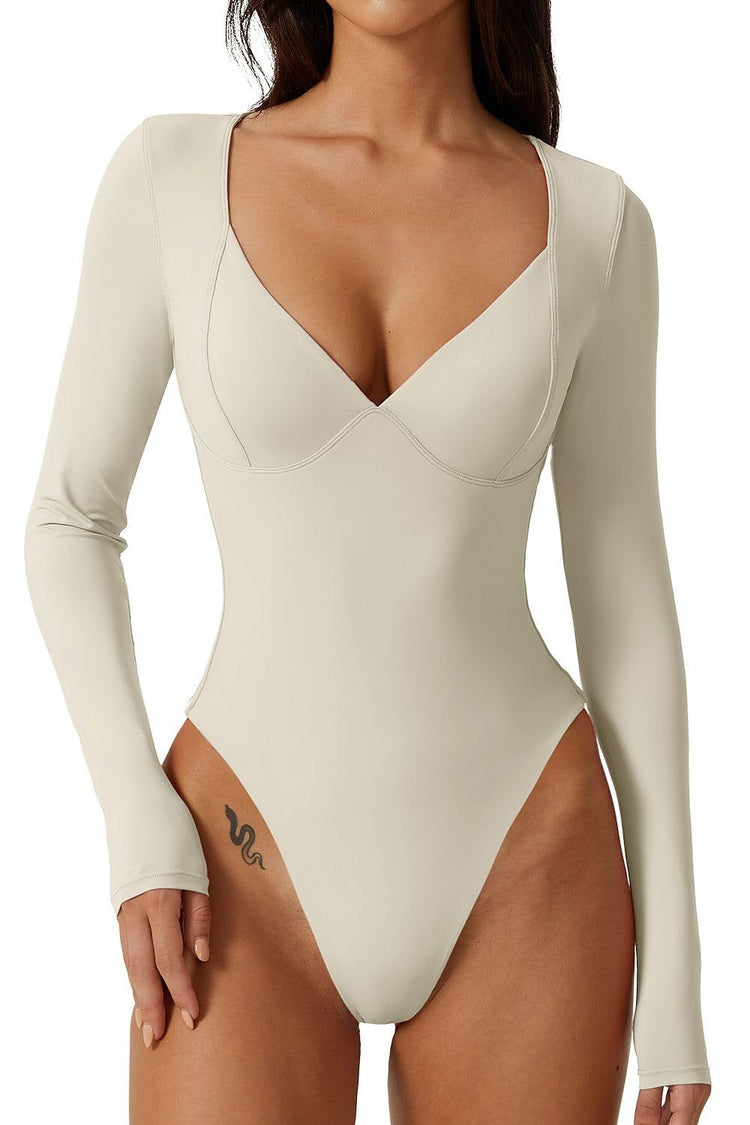 a woman wearing a white leotard