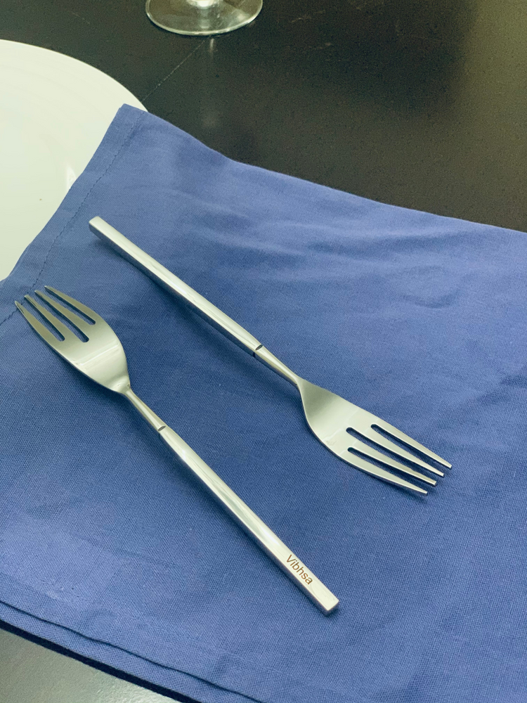 a fork and spoon on a blue towel