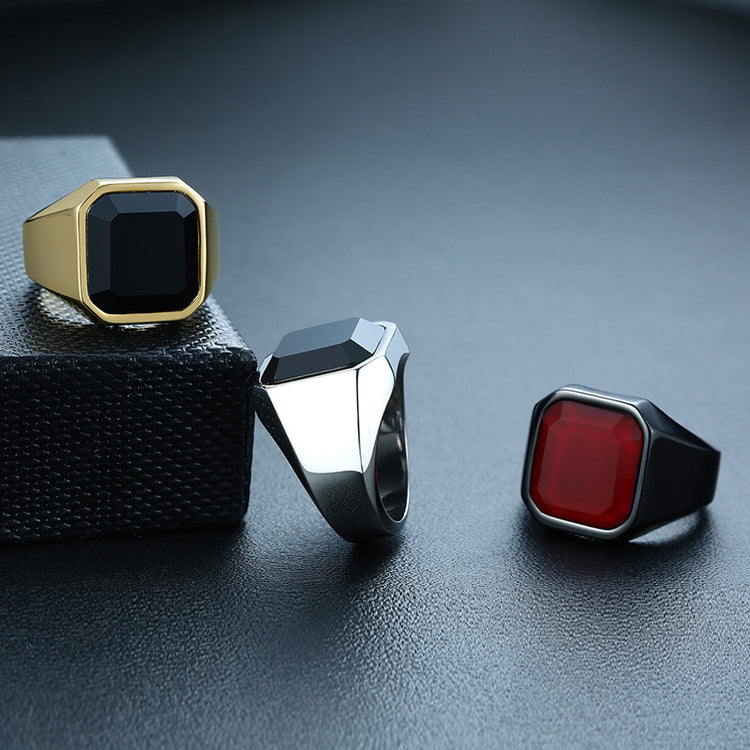 a group of rings on a black surface