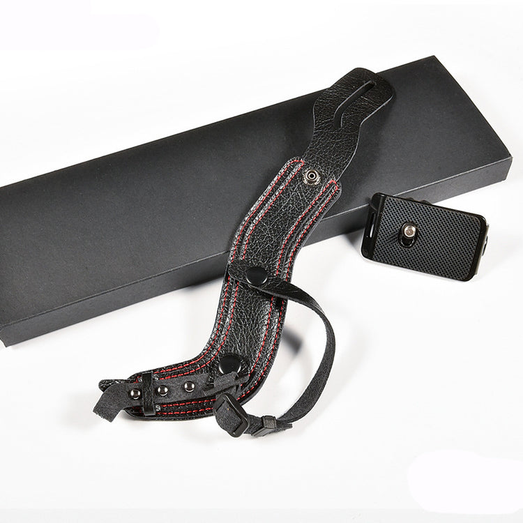 a black box with a strap and a lighter