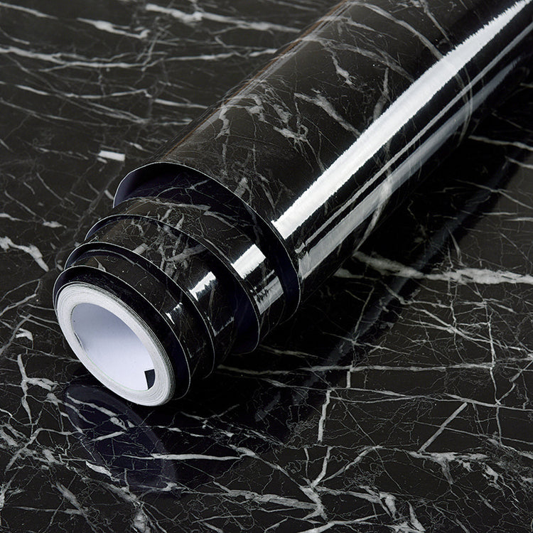 a roll of black and white vinyl