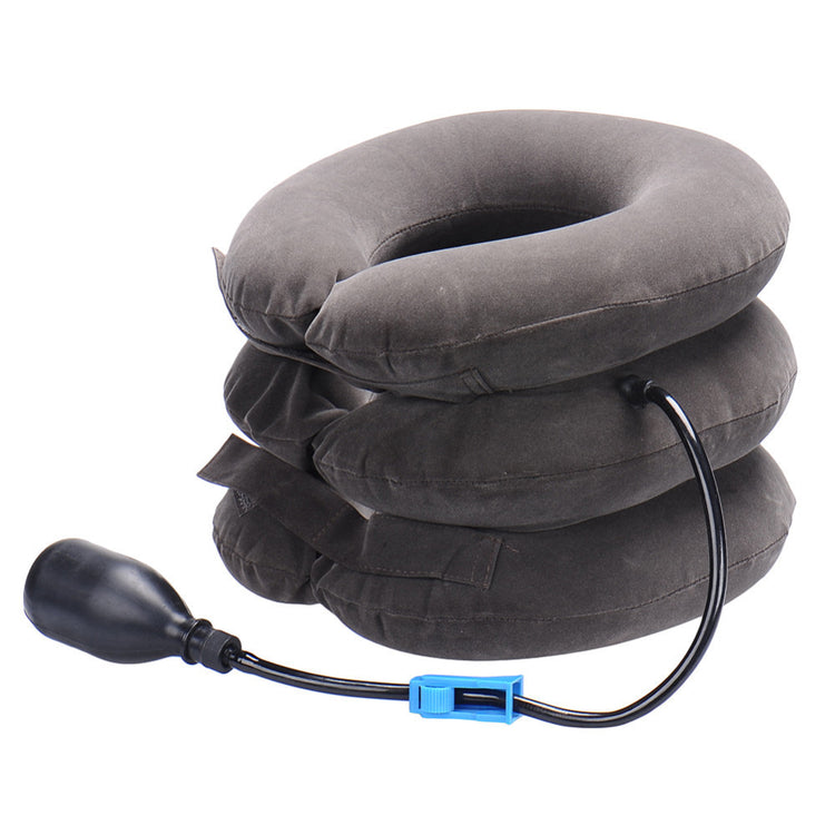 a grey pillow with a black cord