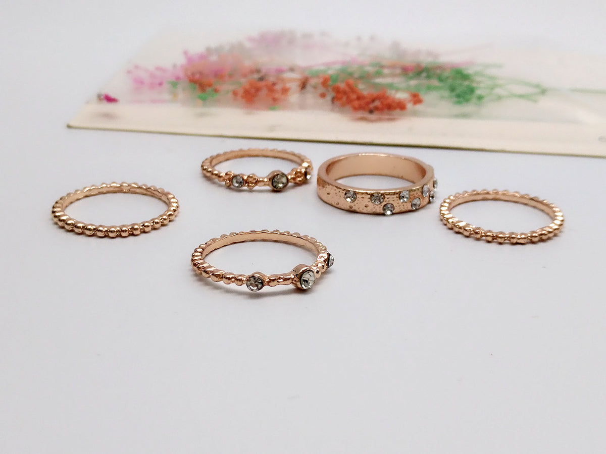 a group of gold rings with diamonds