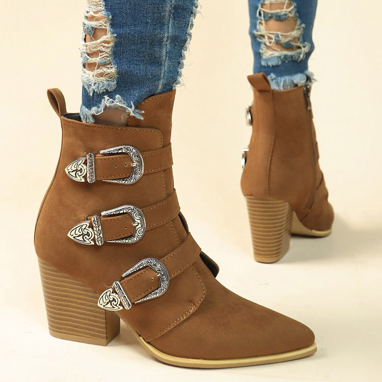 a person wearing ripped jeans and boots