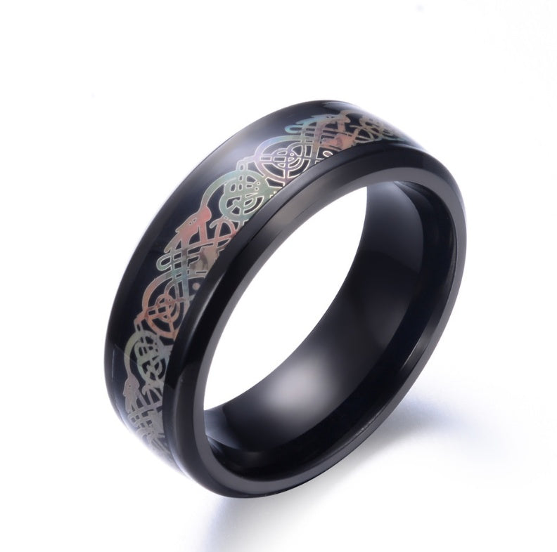 a black ring with a design on it