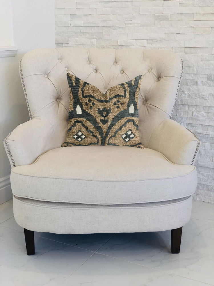 a white chair with a pillow on it