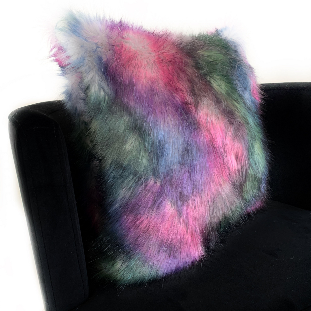 a colorful pillow on a chair